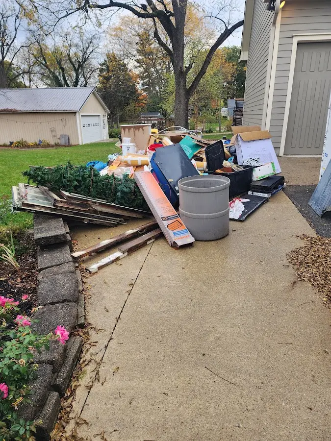 Dumpster being loaded with debris for Residential Dumpster Rental in Gillespie